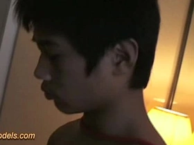 Young Thai boxer in BDSM bondage gets a sensual handjob