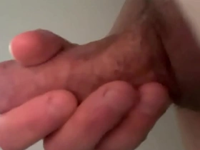 Young boy pleasures his large penis